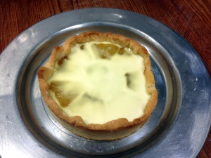 Cream poured over the hot tart.